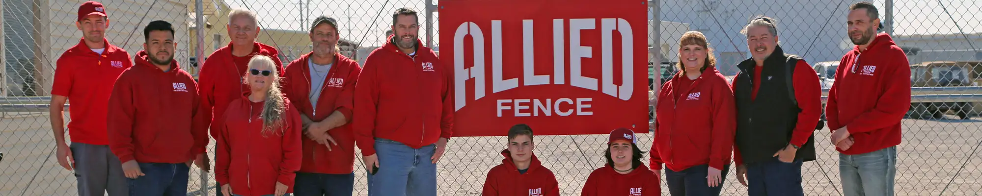 Allied Fence Co. of Tulsa posing for picture in front of main store location