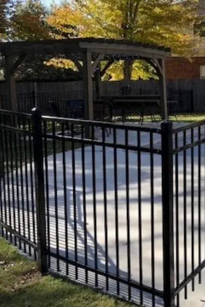 3 Rail Ornamental Iron Fence Surrounding a Pool
